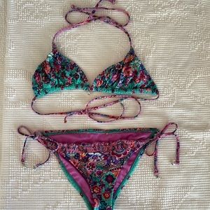 Bikini size, small unknown brand and teal with purple blues and pink.